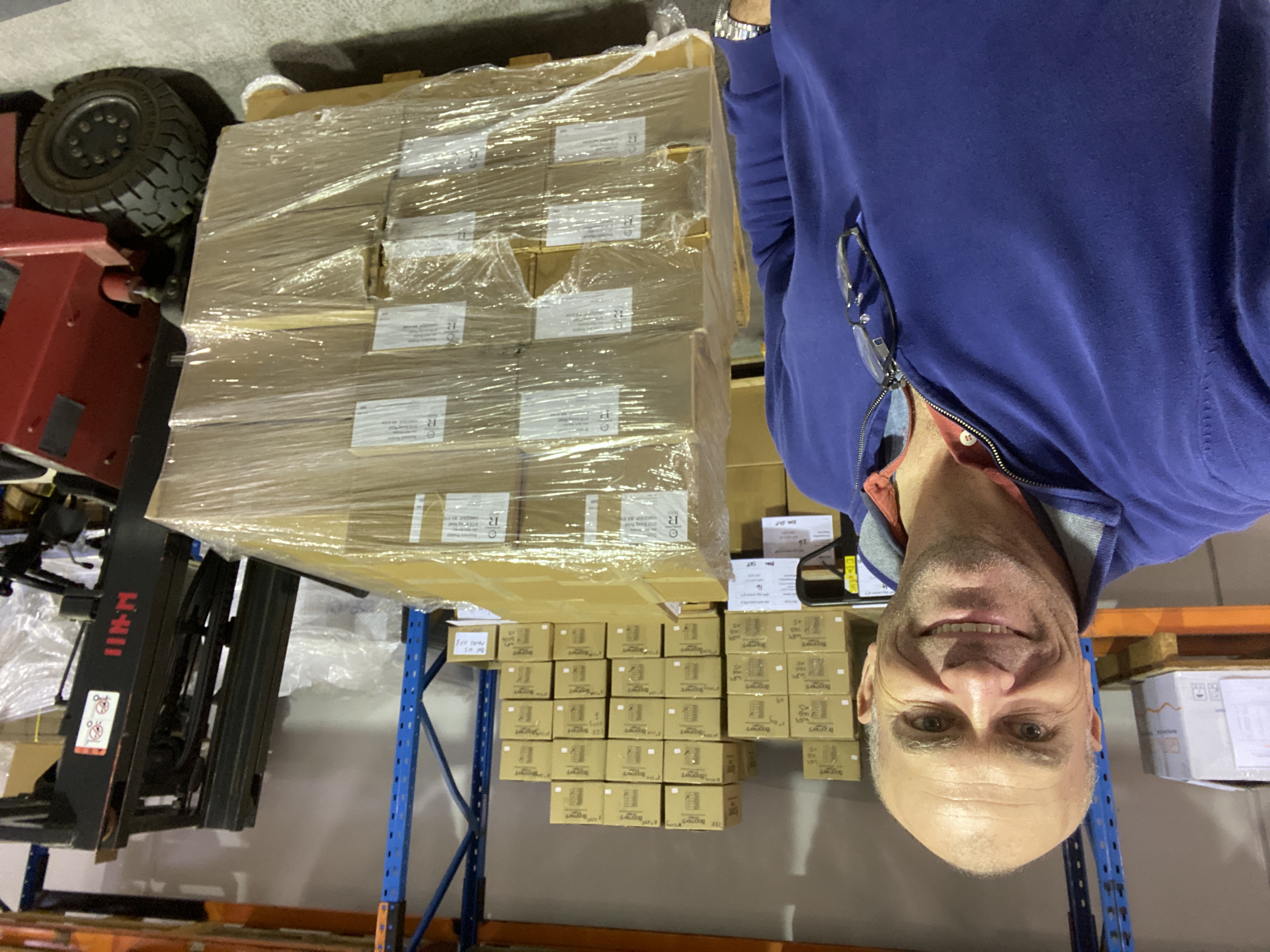 Mark Woodley in the protein business warehouse with a packed pallet ready for dispatch